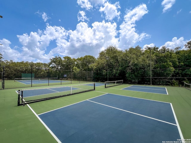 view of sport court with basketball hoop