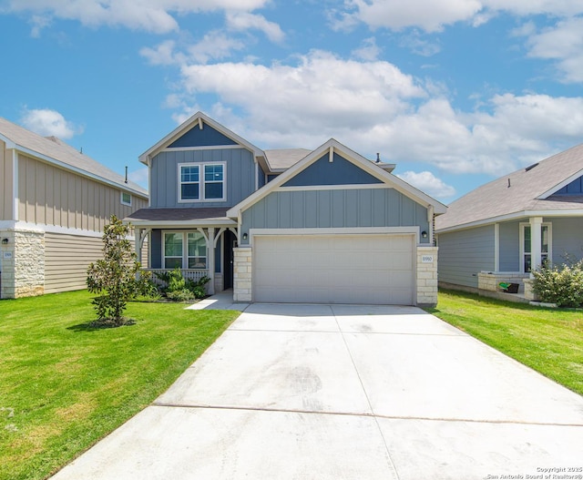 craftsman inspired home with a garage, a porch, and a front yard