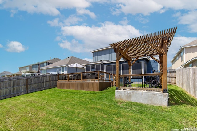 view of yard featuring a wooden deck and a pergola