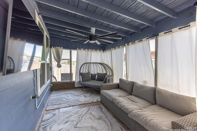 unfurnished sunroom with wood ceiling, ceiling fan, and beam ceiling