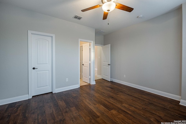 unfurnished bedroom with ceiling fan and dark hardwood / wood-style flooring