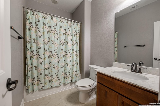 full bathroom featuring shower / bath combination with curtain, tile patterned floors, toilet, and vanity