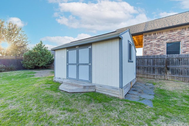 view of outdoor structure featuring a yard