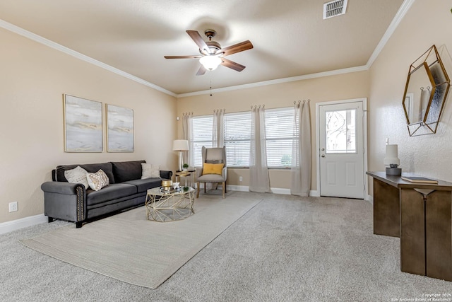 living room featuring crown molding, light colored carpet, and ceiling fan