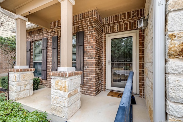 doorway to property with covered porch