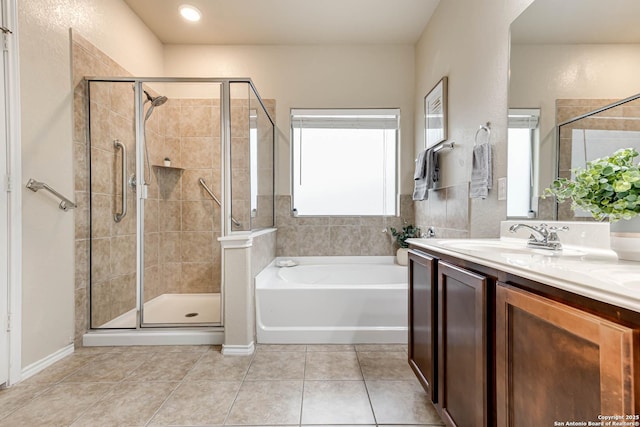 bathroom with vanity, tile patterned floors, and shower with separate bathtub