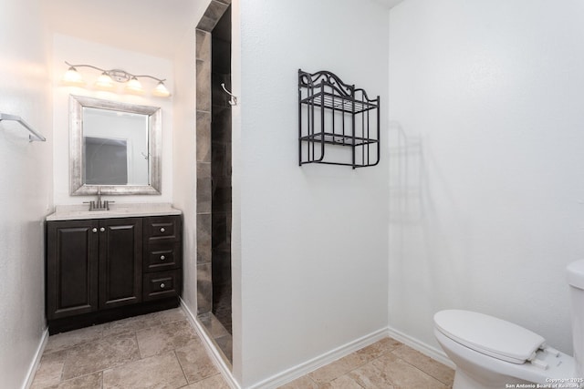 bathroom with vanity, toilet, and walk in shower