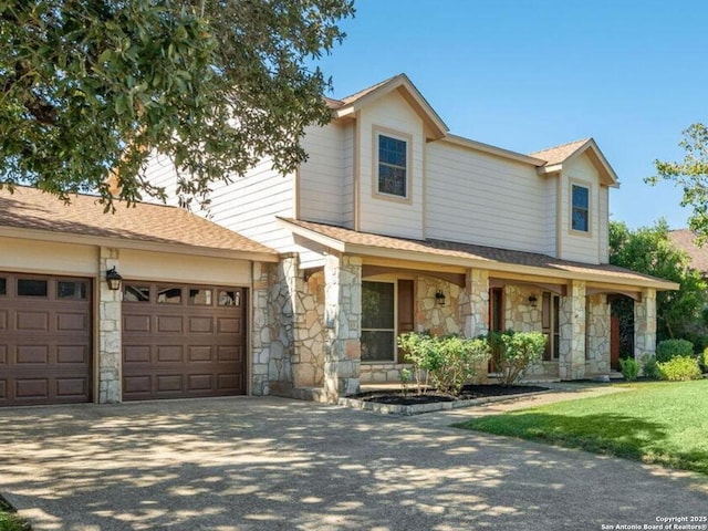 view of front facade featuring a garage and covered porch