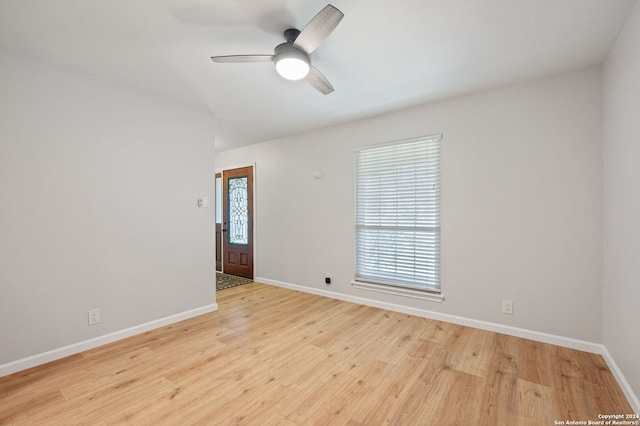 empty room with ceiling fan and light wood-type flooring