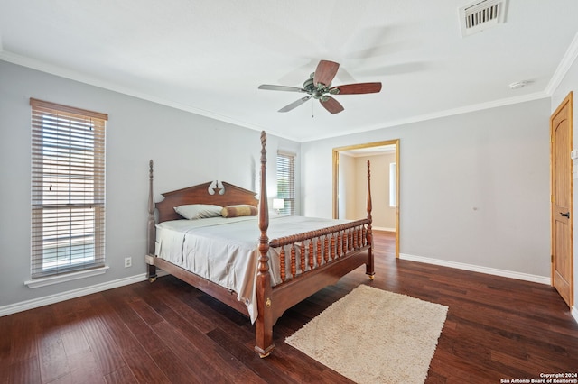 bedroom with ornamental molding, dark hardwood / wood-style floors, and ceiling fan