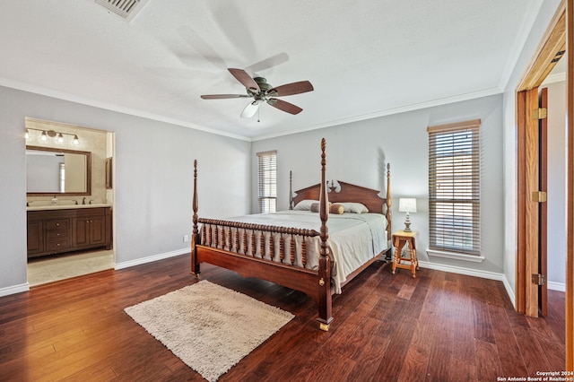 bedroom featuring ceiling fan, ornamental molding, ensuite bathroom, and hardwood / wood-style floors