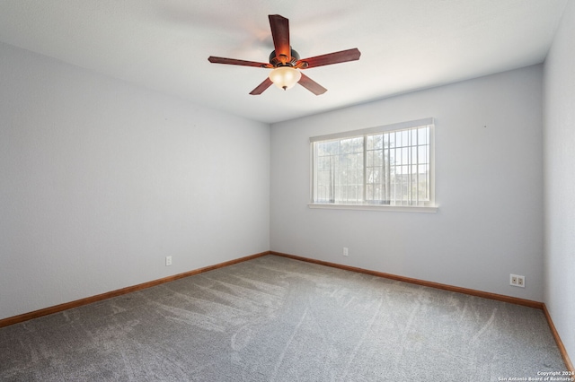 spare room with carpet floors and ceiling fan