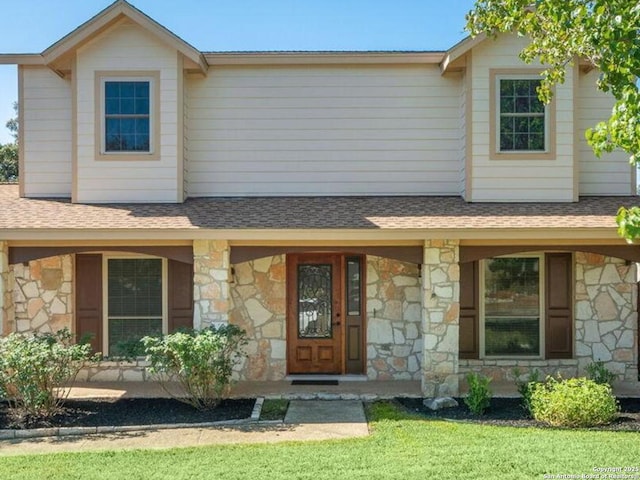 view of front of home with a front yard