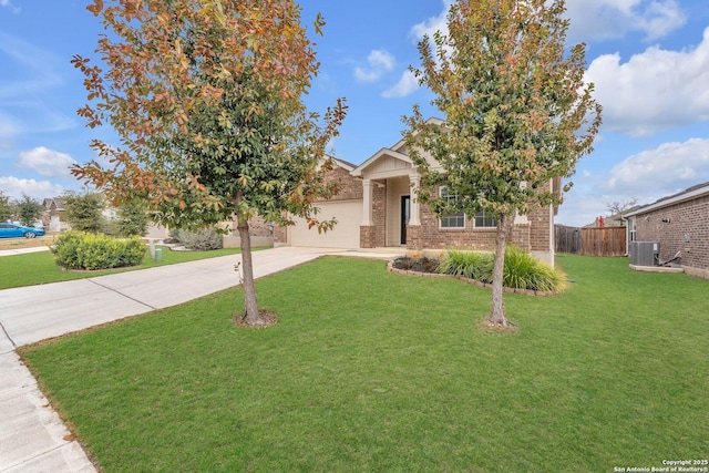 view of property hidden behind natural elements with a garage, a front yard, and central air condition unit