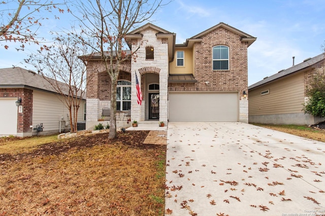 view of front of property with cooling unit and a garage