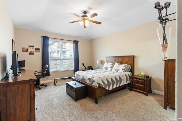 bedroom with ceiling fan and light carpet