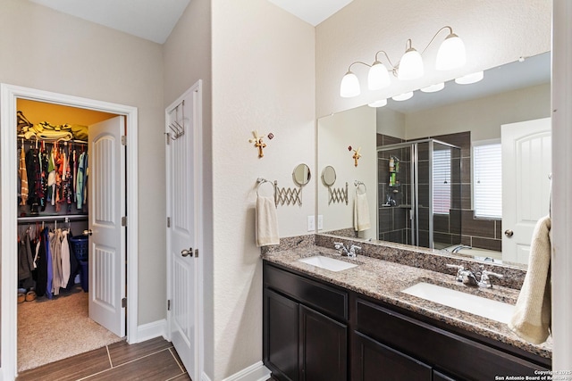 bathroom with vanity and an enclosed shower