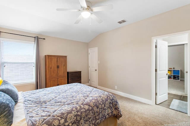 carpeted bedroom featuring ceiling fan and lofted ceiling