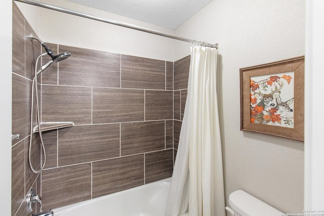 bathroom with toilet, a textured ceiling, and shower / bath combo with shower curtain