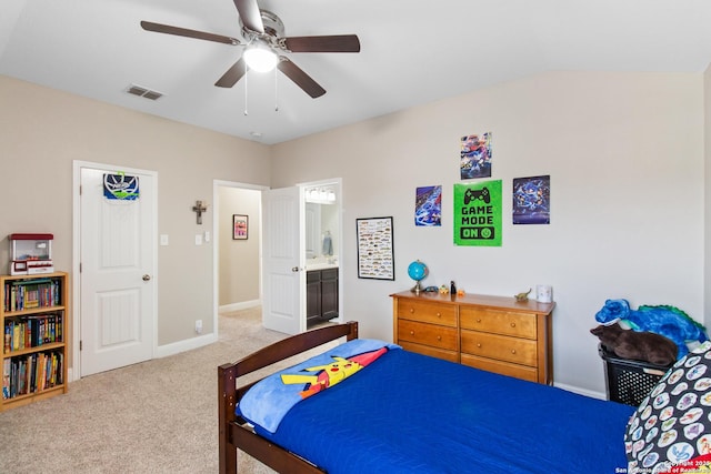 bedroom featuring connected bathroom, ceiling fan, and carpet flooring