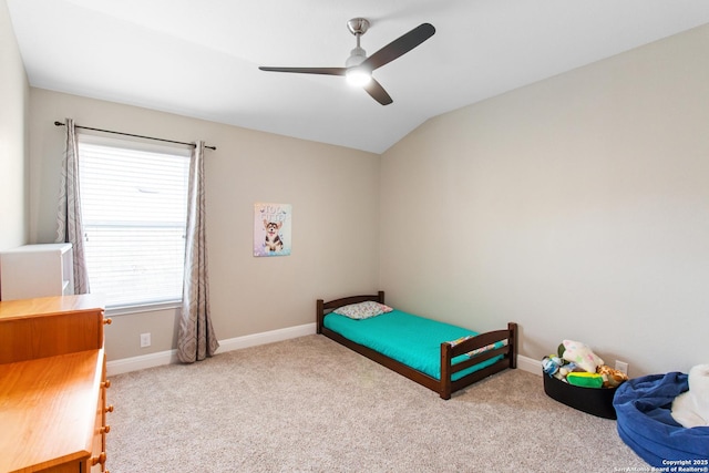 carpeted bedroom featuring lofted ceiling and ceiling fan