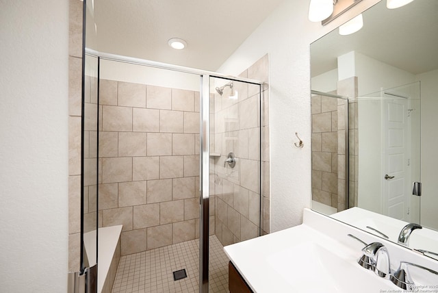 bathroom featuring vanity and walk in shower