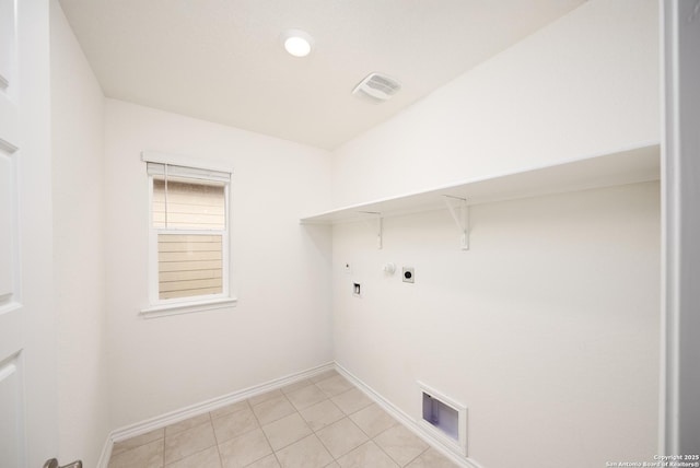 washroom with hookup for a gas dryer, electric dryer hookup, and light tile patterned floors