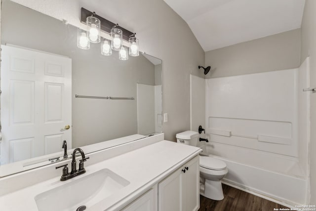 full bathroom featuring shower / bathtub combination, lofted ceiling, hardwood / wood-style flooring, vanity, and toilet