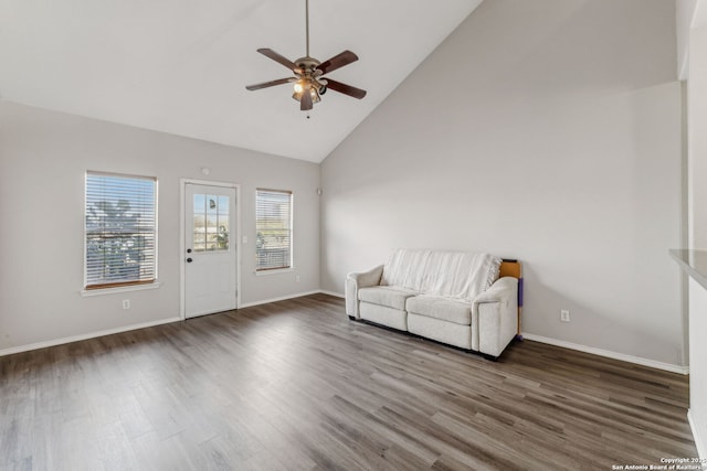 unfurnished room featuring dark wood-type flooring, ceiling fan, and high vaulted ceiling