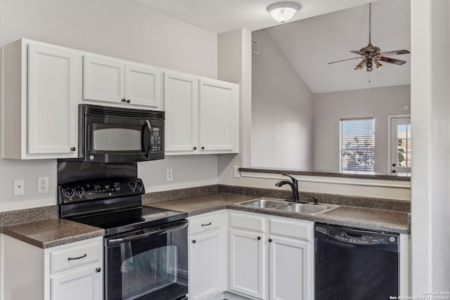 kitchen featuring sink, vaulted ceiling, black appliances, and white cabinets