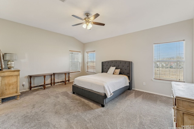 bedroom featuring lofted ceiling, ceiling fan, and carpet