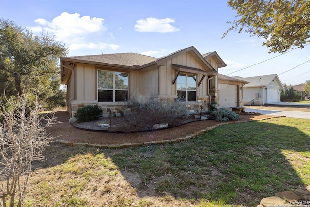 view of front of house featuring a garage and a front lawn