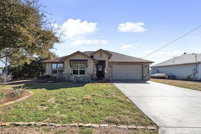 view of front of property with a garage and a front lawn