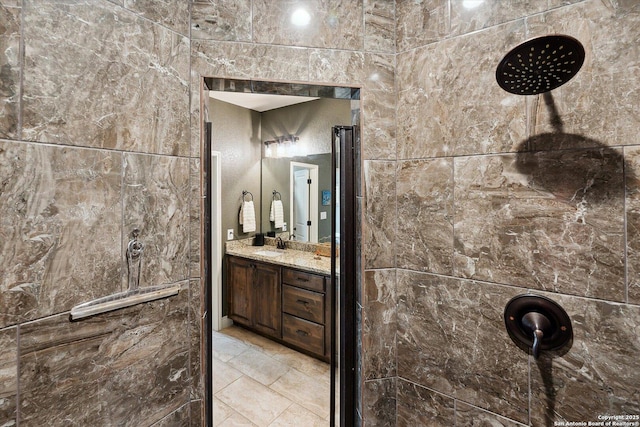 bathroom featuring walk in shower and vanity