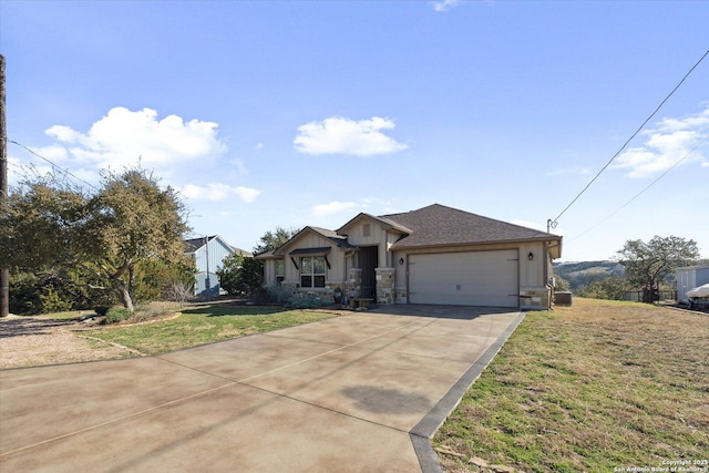 view of front of home with a garage and a front lawn