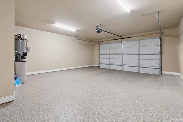 garage with a garage door opener and water heater