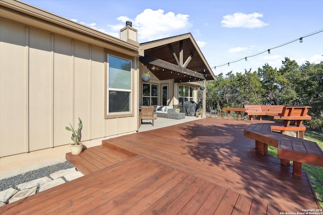 wooden deck featuring an outdoor hangout area