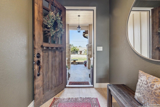 foyer entrance featuring light tile patterned floors