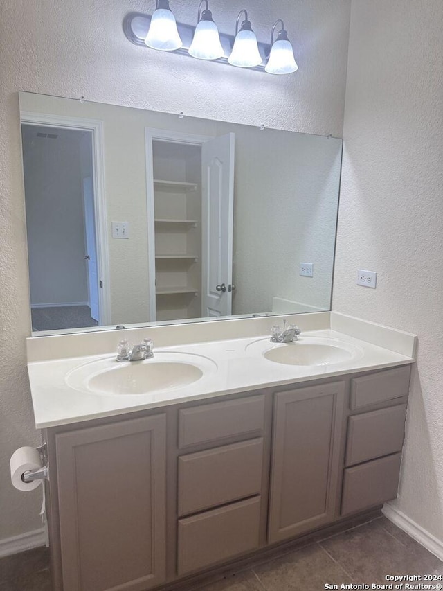 bathroom featuring vanity and tile patterned flooring