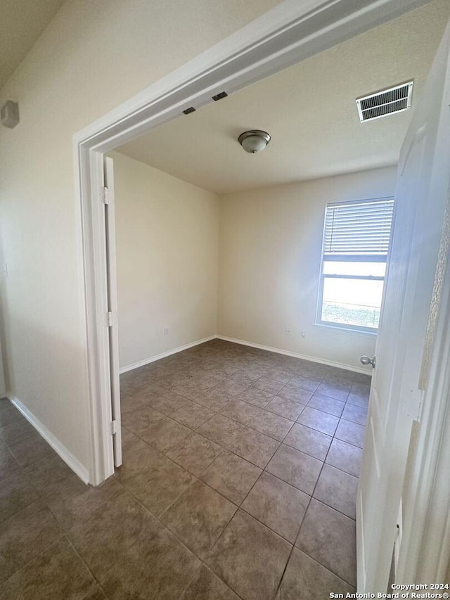 view of tiled spare room