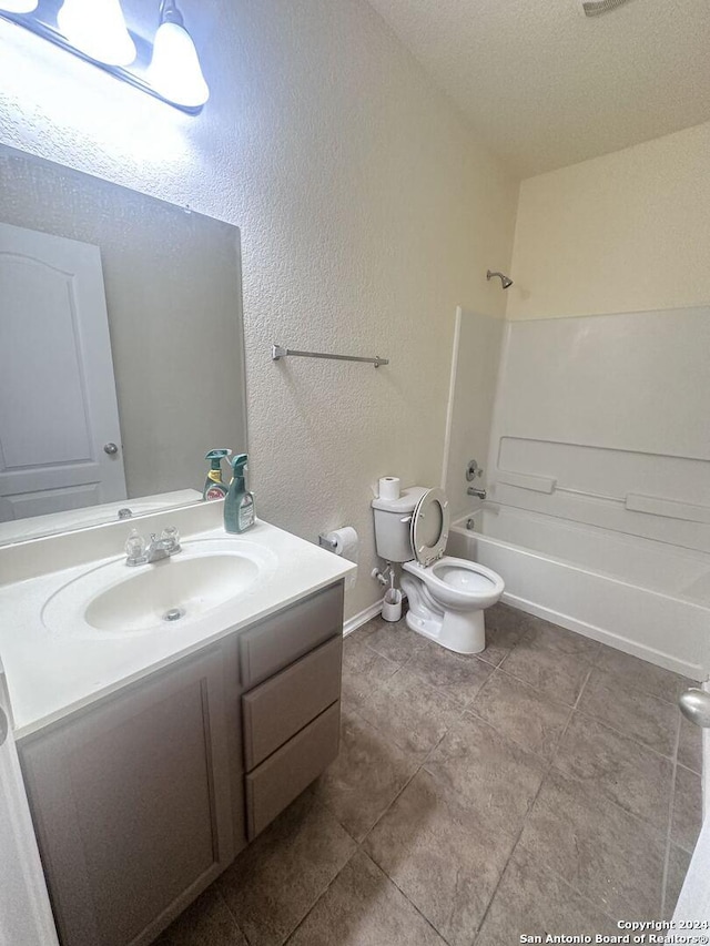 full bathroom with toilet, vanity, and bathtub / shower combination