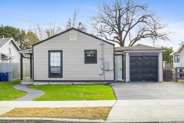 view of front of home featuring a garage and a front lawn