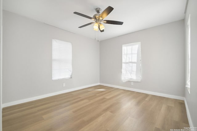 spare room featuring ceiling fan and light hardwood / wood-style floors