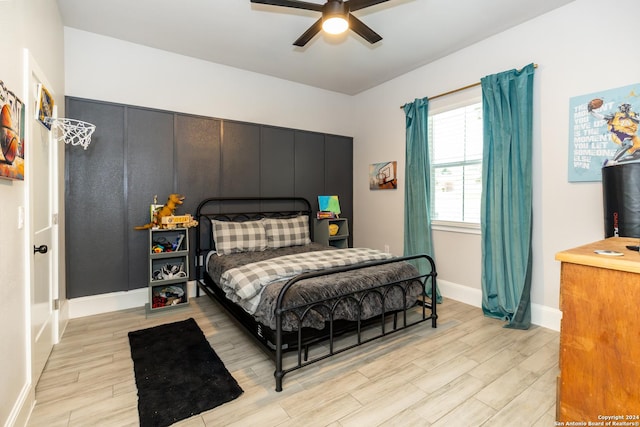 bedroom featuring ceiling fan and light hardwood / wood-style floors