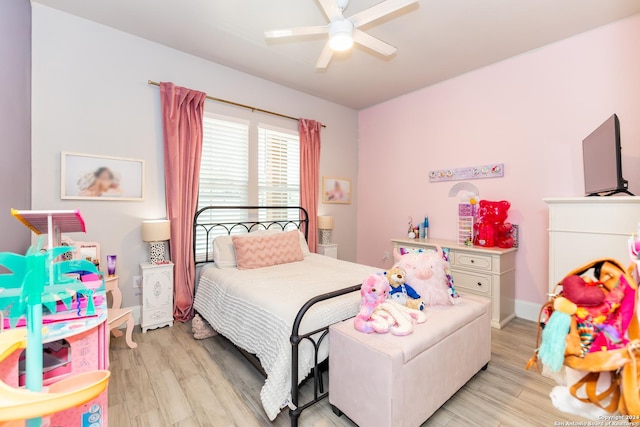 bedroom with ceiling fan and light wood-type flooring