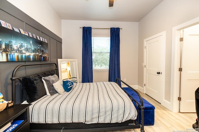 bedroom with ceiling fan and light hardwood / wood-style flooring