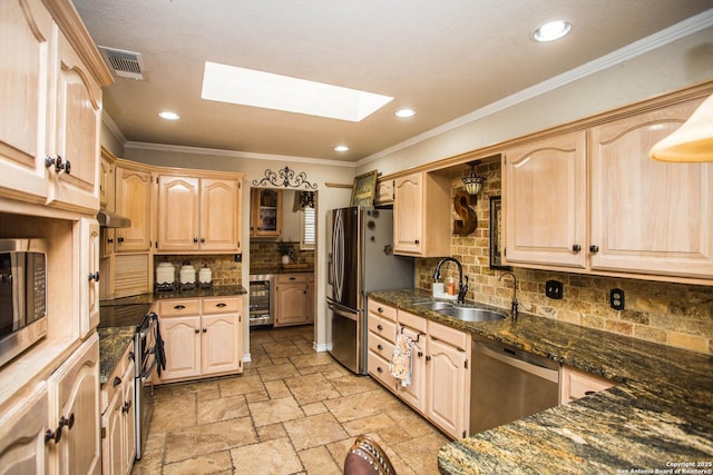 kitchen featuring light brown cabinetry, sink, crown molding, and stainless steel appliances