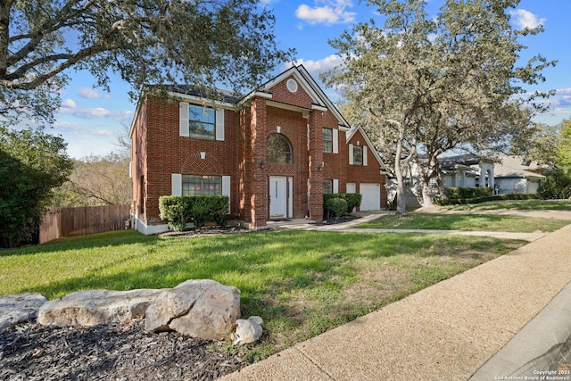 view of front of house featuring a garage and a front lawn