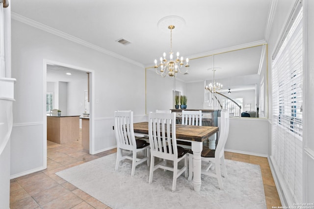 dining room featuring crown molding, light tile patterned flooring, and a notable chandelier