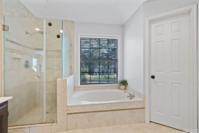 bathroom with tile patterned flooring, vanity, and separate shower and tub